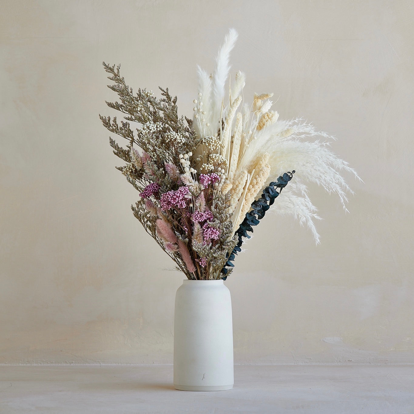 Dried Wildflowers in Milk Glass Vase Centerpiece